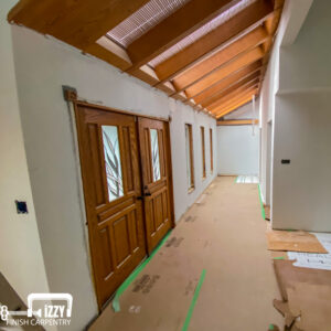 Rustic entrance with wooden doors