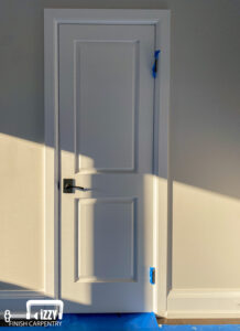 Door with wooden frame and baseboard