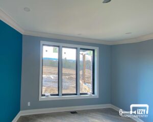 Room with our wooden finishes on the windows, baseboards, and floors