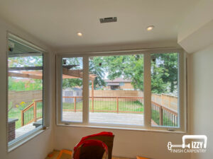 Windows with a wooden deck behind them